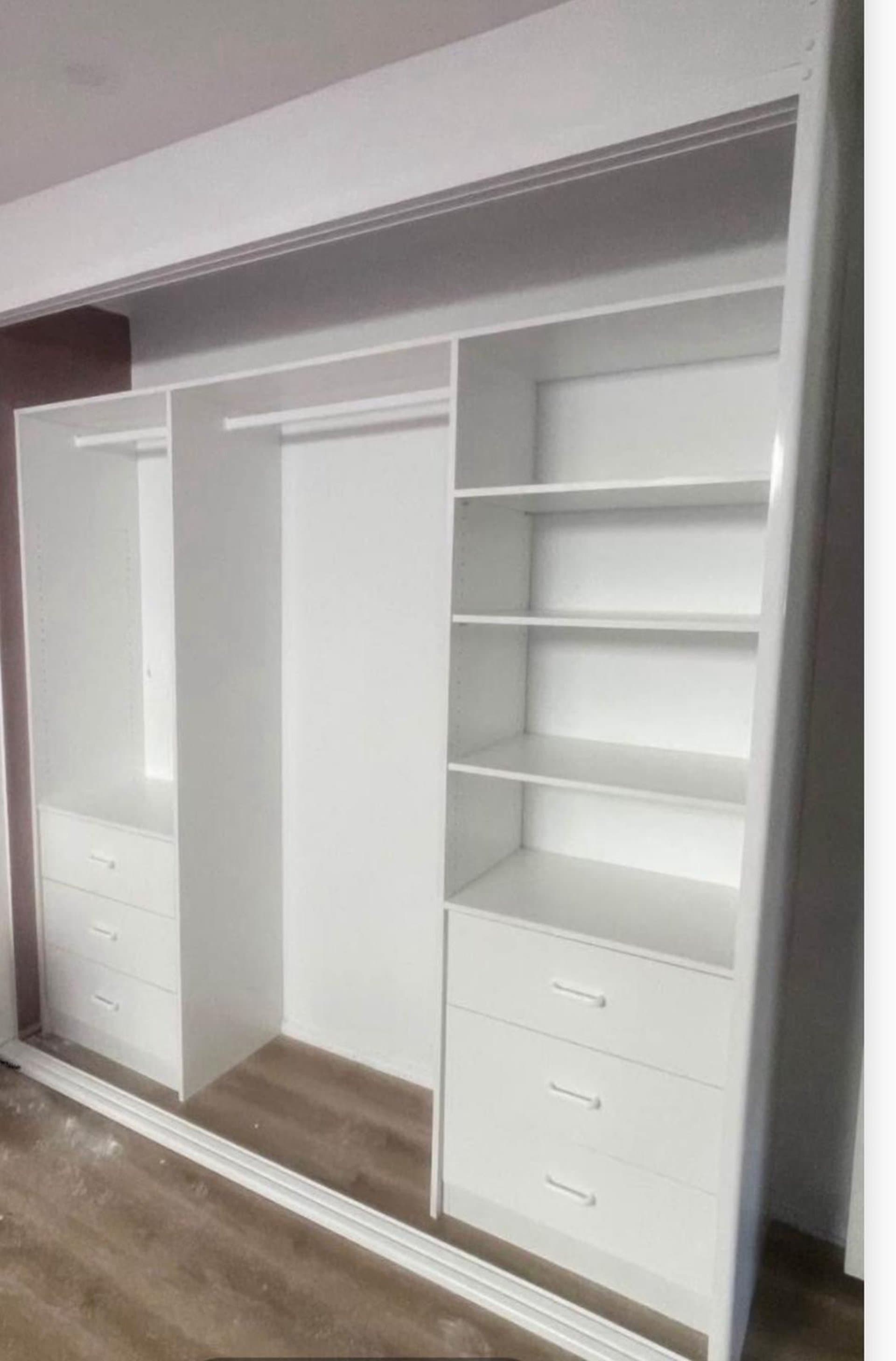 White built-in wardrobe interior with open shelves and hanging space in Sydney