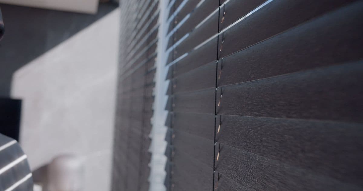 Sydney home with dark Venetian blinds and refined window finishes